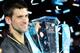 Nov 12, 2012; London, UNITED KINGDOM; Novak Djokovic (SRB) holds his trophy after winning the mens singles final against Roger Federer (SUI) during the ATP World Tour Finals at the O2 Arena. Mandatory Credit: Leo Mason-USA TODAY Sports