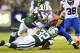 EAST RUTHERFORD, NJ - SEPTEMBER 22: Jim Leonhard #35 of the Buffalo Bills is tackled by linebacker Nick Bellore #54 and safety Josh Bush #32 of the New York Jets on a punt return in the fourth quarter of a game at MetLife Stadium on September 22, 2013 in East Rutherford, New Jersey. The Jets defeated the Bills 27-20. (Photo by Rich Schultz /Getty Images)
