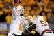 Texas quarterback Case McCoy attempts a pass against the West Virginia Mountaineers in Morgantown, WV