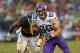 CHICAGO, IL - SEPTEMBER 15: John Carlson #89 of the Minnesota Vikings is chased by James Anderson #50 of the Chicago Bears at Soldier Field on September 15, 2013 in Chicago, Illinois. The Bears defeated the Vikings 31-30. (Photo by Jonathan Daniel/Getty Images)