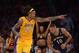 Nov 12, 2013; Los Angeles, CA, USA; Los Angeles Lakers forward Jordan Hill (27) celebrates as New Orleans Pelicans guard Eric Gordon (10) watches at Staples Center. The Lakers defeated the Pelicans 116-95. Mandatory Credit: Kirby Lee-USA TODAY Sports
