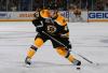 Hi-res-187374975-torey-krug-of-the-boston-bruins-shoots-the-puck-against_crop_north