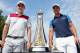 Justin Rose (L) and Henrik Stenson (R) pose with trophy in Dubai.