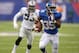 Nov 10, 2013; East Rutherford, NJ, USA; New York Giants running back Andre Brown (35) is pursued by Oakland Raiders defensive end Jason Hunter (93) at MetLife Stadium. The Giants defeated the Raiders 24-20. Mandatory Credit: Kirby Lee-USA TODAY Sports