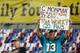 TAMPA, FL - NOVEMBER 11: A Miami Dolphins fan holds up a sign prior to their game against the Tampa Bay Buccaneers at Raymond James Stadium on November 11, 2013 in Tampa, Florida. (Photo by Mike Ehrmann/Getty Images)