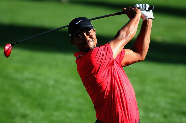 Hi-res-187560310-tiger-woods-of-the-usa-plays-his-second-shot-on-the_crop_north