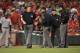 CINCINNATI, OH - JUNE 4: Home plate umpire Gary Cederstrom #38 discusses with the other umpires whether a ball hit by Troy Tulowitzki #2 of the Colorado Rockies in the eighth inning against the Cincinnati Reds is a home run at Great American Ball Park on June 4, 2013 in Cincinnati, Ohio. After an instant replay review the hit was ruled a home run and the Rockies defeated the Reds 5-4. (Photo by Jamie Sabau/Getty Images)