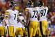 LANDOVER, MD - AUGUST 19: Quarterback Ben Roethlisberger #7 of the Pittsburgh Steelers talks with linemen Ramon Foster #73 and Cameron Heyward #97 after the Steelers kicked a first half field goal against the Washington Redskins during a preseason game at FedExField on August 19, 2013 in Landover, Maryland. (Photo by Rob Carr/Getty Images)