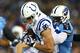 NASHVILLE, TN - NOVEMBER 14: Coby Fleener #80 of the Indianapolis Colts tries to break the tackle of Jason McCourty #30 of the Tennessee Titans in the first quarter at LP Field on November 14, 2013 in Nashville, Tennessee. (Photo by Andy Lyons/Getty Images)