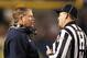 Nov 9, 2013; Pittsburgh, PA, USA; Notre Dame Fighting Irish head coach Brian Kelly (left) talks to head linesman Steve Clein (right) against the Pittsburgh Panthers during the first quarter at Heinz Field. Mandatory Credit: Charles LeClaire-USA TODAY Sports