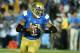 PASADENA, CA - NOVEMBER 02: Quarterback Brett Hundley #17 of the UCLA Bruins rolls out against the Colorado Buffaloes at the Rose Bowl on November 2, 2013 in Pasadena, California. (Photo by Stephen Dunn/Getty Images)