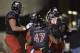 DEKALB, IL - NOVEMBER 13: Quarterback Jordan Lynch #6 of the Northern Illinois Huskies (R) celebrates with his teammates after a 16-yard touchdown run during the fourth quarter against the Ball State Cardinals at Huskie Stadium on November 13, 2013 in DeKalb, Illinois. Northern Illinois defeated Ball State 48-27. (Photo by Brian Kersey/Getty Images)