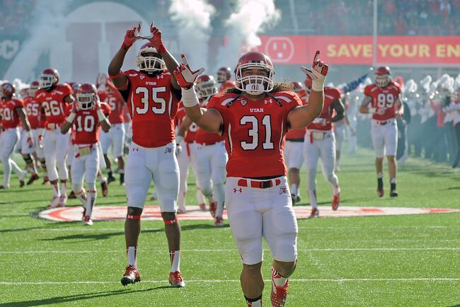 Hi-res-188101187-running-back-soni-kinikini-of-the-utah-utes-leads-his_crop_north