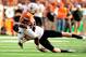 AUSTIN, TX - NOVEMBER 16: Caleb Lavey #45 of the Oklahoma State Cowboys brings down Kendall Sanders #2 of the Texas Longhorns during a game at Darrell K Royal-Texas Memorial Stadium on November 16, 2013 in Austin, Texas. Oklahoma State won the game 38-13. (Photo by Stacy Revere/Getty Images)