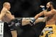 Nov 16, 2013; Las Vegas, NV, USA; Georges St-Pierre (red gloves) fights against Johny Hendricks (blue gloves) in their welterweight championship bout during UFC 167 at MGM Grand Garden Arena. Mandatory Credit: Stephen R. Sylvanie-USA TODAY Sports