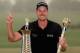 DUBAI, UNITED ARAB EMIRATES - NOVEMBER 17: Henrik Stenson of Sweden poses with the Race To Dubai trophy and the DP World Tour Championship trophy after winning the DP World Tour Championship, Dubai on the Earth Course at Jumeirah Golf Estates on November 17, 2013 in Dubai, United Arab Emirates. (Photo by Andrew Redington/Getty Images)