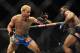 Nov 16, 2013; Las Vegas, NV, USA; Josh Koscheck (red gloves) fights against Tyron Woodley (blue gloves) in their welterweight bout during UFC 167 at MGM Grand Garden Arena. Mandatory Credit: Stephen R. Sylvanie-USA TODAY Sports