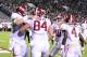 Nov 16, 2013; Starkville, MS, USA; Alabama Crimson Tide tight end Brian Vogler (84) celebrates his touchdown with offensive linesman Ryan Kelly (70) quarterback A.J. McCarron (10) and running back T.J. Yeldon (4) in the end zone against the Mississippi State Bulldogs during the second quarter at Davis Wade Stadium. Mandatory Credit: John David Mercer-USA TODAY Sports