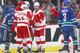 VANCOUVER, BC - OCTOBER 30: Daniel Cleary #71 of the Detroit Red Wings congratulates goals scorer Daniel Alfredsson #11 while Kevin Bieksa #3 and Mike Santorelli #25 of the Vancouver Canucks skate away during their NHL game at Rogers Arena on October 30, 2013 in Vancouver, British Columbia, Canada. (Photo by Jeff Vinnick/NHLI via Getty Images)
