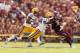 Jalen Mills (left) and Lamin Barrow (middle) chases down Johnny Manziel last season in College Station. All three return for this year's game in Death Valley.