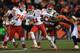 DENVER, CO - NOVEMBER 17: Quarterback Alex Smith #11 of the Kansas City Chiefs rushes with the ball and eludes defensive end Malik Jackson #97 of the Denver Broncos at Sports Authority Field at Mile High on November 17, 2013 in Denver, Colorado. The Broncos defeated the Chiefs 27-17. (Photo by Doug Pensinger/Getty Images)