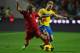 LISBON, PORTUGAL - NOVEMBER 15: Fabio Coentrao of Portugal battles with Sebastian Larsson of Sweden during the FIFA 2014 World Cup Qualifier Play-off First Leg between Portugal and Sweden at Estadio da Luz on November 15, 2013 in Lisbon, Portugal. (Photo by Mike Hewitt/Getty Images)
