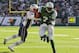 Oct 20, 2013; East Rutherford, NJ, USA; New York Jets quarterback Geno Smith (7) runs for a touchdown during the second half of their game against the New England Patriots at MetLife Stadium. Mandatory Credit: Ed Mulholland-USA TODAY Sports