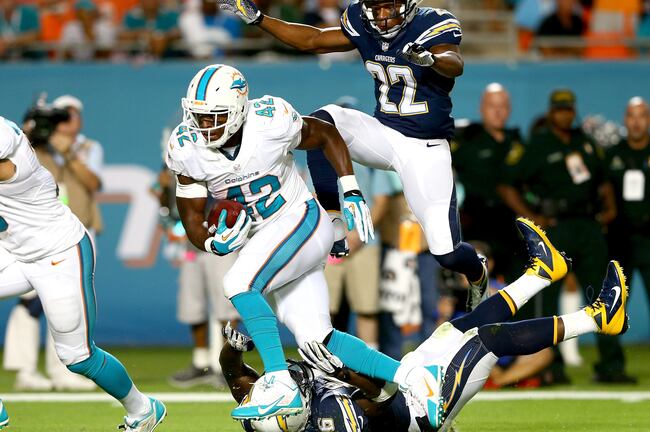 Hi-res-450284035-charles-clay-of-the-miami-dolphins-runs-away-from_crop_north