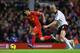 LIVERPOOL, ENGLAND - NOVEMBER 09: Luis Suarez of Liverpool goes past Philippe Senderos of Fulham on his way to scoring the fourth goal during the Barclays Premier League match between Liverpool and Fulham at Anfield on November 9, 2013 in Liverpool, England. (Photo by Alex Livesey/Getty Images)