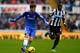 NEWCASTLE UPON TYNE, ENGLAND - NOVEMBER 02: Oscar of Chelsea is shadowed by Cheik Ismael Tiote of Newcastle United during the Barclays Premier League match between Newcastle United and Chelsea at St James' Park on November 2, 2013 in Newcastle upon Tyne, England. (Photo by Shaun Botterill/Getty Images)