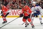Hi-res-187619202-johnny-oduya-of-the-chicago-blackhawks-looks-up-the-ice_crop_north