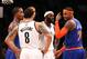 Nov. 26, 2012; Brooklyn, NY, USA; New York Knicks small forward Carmelo Anthony (7) gestures to Brooklyn Nets point guard Deron Williams (8) during the second half at the Barclays Center. Nets won in overtime 96-89. Mandatory Credit: Debby Wong-USA TODAY Sports