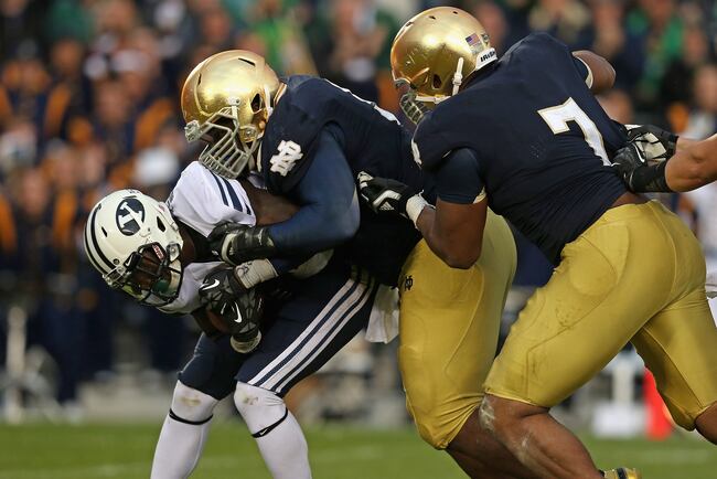 Hi-res-154666456-jamaal-williams-of-the-byu-cougars-is-dropped-by_crop_north