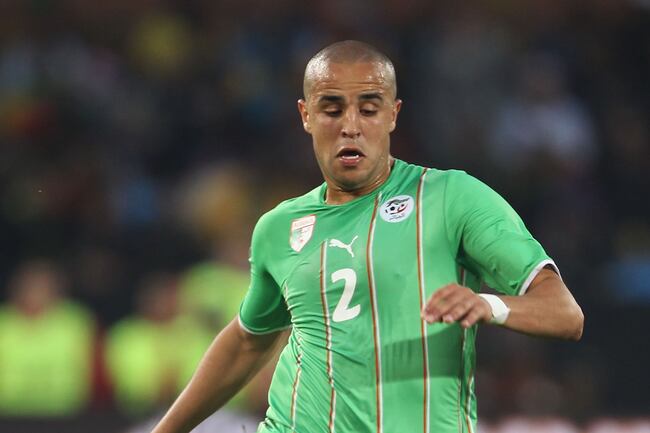Hi-res-102338085-madjid-bougherra-of-algeria-runs-with-the-ball-during_crop_north