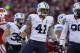 MADISON, WI - NOVEMBER 09: Uani Unga #41 of the BYU Cougars celebrates after making a tackle on James White of the Wisconsin Badgers at Camp Randall Stadium on November 09, 2013 in Madison, Wisconsin. (Photo by Mike McGinnis/Getty Images)