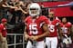 GLENDALE, AZ - OCTOBER 27: Wide receiver Michael Floyd #15 of the Arizona Cardinals leads John Abraham #55 and Rashad Johnson #26 onto the field before the NFL game against the Atlanta Falcons at the University of Phoenix Stadium on October 27, 2013 in Glendale, Arizona. The Cardinals defeated the Falcons 27-13. (Photo by Christian Petersen/Getty Images)