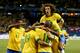 TORONTO, ON - NOVEMBER 19: Hulk #19 of Brazil is congratulated by his teammates after scoring in the first half against Chile during a friendly match at Rogers Centre on November 19, 2013 in Toronto, Canada. David Luz #4 of Brazil is jumping on the pile. (Photo by Elsa/Getty Images)