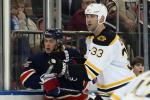 Hi-res-450633435-zdeno-chara-of-the-boston-bruins-gets-the-stick-up-on_crop_north
