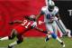 TAMPA, FL - DECEMBER 19: Receiver Calvin Johnson #81 of the Detroit Lions runs through the tackle of defensive back E.J. Biggers #31 of the Tampa Bay Buccaneers during the game at Raymond James Stadium on December 19, 2010 in Tampa, Florida. (Photo by J. Meric/Getty Images)