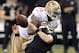 Nov 17, 2013; New Orleans, LA, USA; San Francisco 49ers outside linebacker Ahmad Brooks (55) clotheslines New Orleans Saints quarterback Drew Brees (9) behind the line of scrimmage during the fourth quarter at the Mercedes-Benz Superdome. San Francisco 49ers outside linebacker Ahmad Brooks (55) was called for unnecessary roughness penalty. The New Orleans Saints defeated the San Francisco 49ers 23-20. Mandatory Credit: John David Mercer-USA TODAY Sports