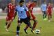 AMMAN, JORDAN- NOVEMBER 13: Luis Suarez of Uruguay and Oday Zahran of Jordan compete for the ball during the FIFA 2014 World Cup Qualifier: Intercontinental Play-off First Leg between Jordan and Uruguay on November 13, 2013 in Amman, Jordan. (Photo by Salah Malkawi/ Getty Images)