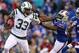 ORCHARD PARK, NY - NOVEMBER 17: Chris Ivory #33 of the New York Jets stiff arms Leodis McKelvin #21 of the Buffalo Bills during NFL game action at Ralph Wilson Stadium on November 17, 2013 in Orchard Park, New York. (Photo by Tom Szczerbowski/Getty Images)