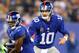 EAST RUTHERFORD, NJ - NOVEMBER 17: Eli Manning #10 of the New York Giants hands the ball off to teammate Andre Brown #35 in the first quarter against the Green Bay Packers at MetLife Stadium on November 17, 2013 in East Rutherford, New Jersey. (Photo by Elsa/Getty Images)