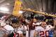 MINNEAPOLIS - NOVEMBER 17: Players from the Wisconsin Badgers celebrate with the Paul Bunyan trophy following their victory over the Minnesota Golden Gophers at the Hubert H. Humphrey Metrodome November 17, 2007 in Minneapolis, Minnesota. Wisconsin defeated Minnesota 41-34. (Photo by Jeff Gross/Getty Images)