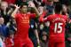 LIVERPOOL, ENGLAND - NOVEMBER 09: Luis Suarez of Liverpool celebrates scoring the third goal with his team-mate Daniel Sturridge during the Barclays Premier League match between Liverpool and Fulham at Anfield on November 9, 2013 in Liverpool, England. (Photo by Alex Livesey/Getty Images)