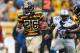 PITTSBURGH, PA - NOVEMBER 17: Le'Veon Bell #26 of the Pittsburgh Steelers looks for yards during a second quarter run in front of Stephen Tulloch #55 of the Detroit Lions at Heinz Field on November 17, 2013 in Pittsburgh, Pennsylvania. (Photo by Gregory Shamus/Getty Images)