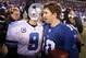 Jan 1, 2012; East Rutherford, NJ, USA; New York Giants quarterback Eli Manning (10) and Dallas Cowboys quarterback Tony Romo (9) meet on the field after their game at MetLife Stadium. Giants won 31-14. Mandatory Credit: Chris Faytok/The Star-Ledger via USA TODAY Sports