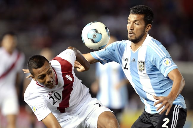 Hi-res-184185204-ezequiel-garay-of-argentina-vies-for-the-ball-with-luis_crop_north