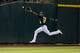 OAKLAND, CA - SEPTEMBER 20: Chris Young #25 of the Oakland Athletics fields a ball hit off the bat of Eduardo Escobar (not pictured) of the Minnesota Twins for a single during the second inning at O.co Coliseum on September 20, 2013 in Oakland, California. (Photo by Jason O. Watson/Getty Images)