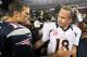 Oct 7, 2012; Foxborough, MA, USA; New England Patriots quarterback Tom Brady (12) shakes hands with Denver Broncos quarterback Peyton Manning (18) following the game at Gillette Stadium. The Patriots defeated the Broncos 31-21. Mandatory Credit: Stew Milne-USA TODAY Sports